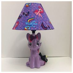 a little pony lamp sitting on top of a table