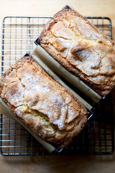 two pieces of bread sitting on top of a cooling rack