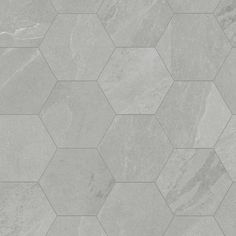 a grey tile floor with hexagonal shapes