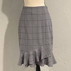 Banana Republic. Nwt. Beautiful, Grey, Windowpane, Tulip Shaped, Pencil Skirt. This Gorgeous Skirt Is Slightly Fitted With A Bit Of Stretch To Provide A Flattering Fit Perfect For The Office Or After Work Happy Hour. This Skirt Features A Ruffle, Tulip Shaped Hem And Hits Below The Knee. Wool/Spandex/Polyester Blend. Size 2, Brand New, Never Been Worn. Nwt. Elegant Fitted Plaid Skirt, Chic Fitted Plaid Skirt, Ruffled Pencil Skirt For Workwear, Elegant Plaid Skirt, Ruffled Pencil Skirt For Work, Elegant Plaid Knee-length Skirt, Elegant Knee-length Plaid Skirt, Fitted Plaid Pencil Skirt, Elegant Fitted Plaid Bottoms