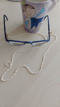 "You can always wear it easily. You can use it not only as eyeglass chain, but also as a necklace and bracelet with white color. Measures approx. 30\" (75 cm) total length Sunglasses necklace will be a perfect gift for yourself and your loved ones. The price is for 1 piece of eyeglass . I can make it in any color you want. Please contact me. Thank you for visiting my store." Trendy White Beaded Necklaces With Adjustable Chain, Trendy White Beaded Necklace With Adjustable Chain, White Adjustable Glasses Chains For Fashion, White Glass Glasses Chains With Colorful Beads, White Beaded Necklace With Adjustable Chain As Gift, Trendy White Glasses Chains With Colorful Beads, White Glass Glasses Chains For Fashion Accessory, Trendy White Beaded Glasses Chain, White Glass Fashion Accessory Glasses Chains