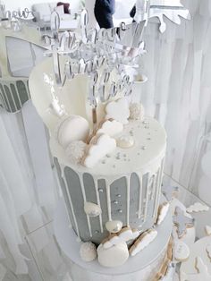 a white cake with frosting and decorations on it