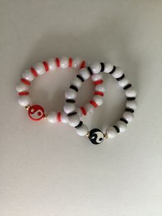 A Yin Yang set with 2 bracelets! One is red amd the other one is black and its made with love! Red Stretch Bracelet For Friendship In Trendy Style, Trendy Red Stretch Bracelet For Friendship, Casual Red Beaded Friendship Bracelets, Trendy Red Round Beads Stretch Bracelet, Trendy Red Stretch Bracelet With Round Beads, Trendy Handmade Red Stretch Bracelet, Trendy Red Handmade Beaded Bracelets, Casual Red Wristband With Round Beads, Red Spiritual Beaded Bracelets For Everyday