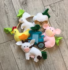 a basket filled with farm animals on top of a wooden floor