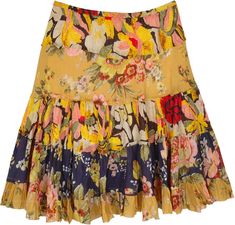 A peppy tiered skirt in a yellow summer tone and mixed floral print on each tier. This cotton skirt has five unfinished tiers for a fun flowy look. #tlb #TieredSkirt #Floral #Printed #FloralSkirt #ColorfulSkirt #BeachSkirt Tiered Floral Print Beach Skirt, Bohemian Yellow Tiered Skirt, Yellow Bohemian Skirt With Ruffles, Yellow Tiered Ruffled Skirt, Yellow Ruffled Skirt For Beach, Yellow Ruffled Beach Skirt, Summer Floral Patchwork Tiered Skirt, Yellow Bohemian Ruffled Skirt, Yellow Floral Print Skirt