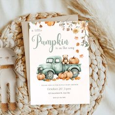 a little pumpkin is on the way baby shower card next to a stuffed animal and rope basket