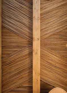 the inside of a building with wooden slatted walls