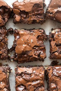 chocolate brownies cut into squares on a white surface