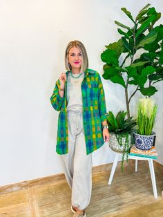 When the vacation vibes are calling, the Vacation Booked Button Down is the answer! With its playful blue and green hues, this lightweight shacket is your go-to for layering over anything from a chic jumpsuit to your favorite jeans. Perfect for breezy fall days, it’s an effortless addition to your wardrobe that’s as versatile as it is stylish. Wear it for a stroll through a fall farmers market or to cozy up at a weekend bonfire, and let this button-down become your ultimate travel companion. PRO Trendy Cotton Beach Outerwear, Green Outerwear For Vacation In Spring, Green Spring Outerwear For Vacation, Green Long Sleeve Outerwear For Vacation, Green Outerwear For Spring Vacation, Casual Oversized Green Shacket, Casual Long Sleeve Shacket For Day Out, Trendy Green Oversized Shacket, Trendy Shacket With Buttons For Day Out