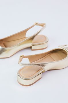 Looking for a sweet and stylish shoe? Check out our Sweetie slingback low heel! With a metallic gold finish and a pointed square toe, you'll be sure to turn heads. Plus, the adjustable strap adds comfort and versatility. General Info: Slingback Style Low Heel - 1" Metallic Gold Pointed Square Toe Adjustable Strap Square Shoes, Dirty Laundry, Buy One Get One, Stylish Shoes, Clothing Company, Metallic Gold, Low Heels, Wedding Outfit, Gold Finish