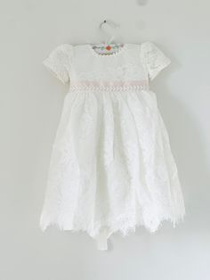 Beautiful and elegant baby girls' lace baptism dress. Two-piece set including a delicately embroidered short-sleeve gown with matching lace bonnet. Complete with a linen and cotton blend liner, to ensure comfort. Feel free to add one of our adorable headbands to complete the look. Spring Lace Baptism Dress With Lace Trim, Cream Baptism Dress With Lace Trim, Elegant Off-white Lace Baptism Dress, White Lace Trim Baptism Dress For Babies, Cotton Baptism Dress With Lace Trim, Girls Baptism Dress, Baby Baptism Dress, Baptism Dress Baby Girl, Lace Bonnet