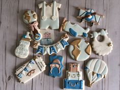 decorated cookies are arranged on a wooden table