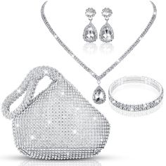 PRICES MAY VARY. Silver Rhinestone Accessories Set: you will receive 1 piece of clutch purse, 1 piece of necklace, 1 pair of earrings, 1 piece of bracelet, nice for evening party, dance party, prom, wedding, Christmas party or other formal occasions Evening Clutch Purses: the silver evening clutch is fully decorated with rhinestone crystals, which will make you a dazzling one on every occasion; Combination of zipper or snap design makes it more convenient to use Crystal Jewelry Set: the silver p Silver Prom Jewelry, Rhinestone Accessories, Silver Clutch Purse, Prom Jewelry Sets, Rhinestone Purse, Prom Purse, Wedding Bride Jewelry, Stone Statement Necklace, Silver Clutch