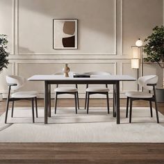 a dining room table with four chairs and a potted plant on the far side