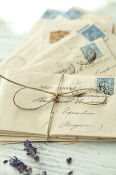 some old envelopes are tied up with twine