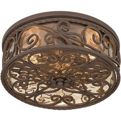 a ceiling light with an intricate design on the top and bottom part of it's glass