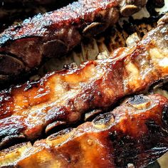 some meat is being grilled on a grill