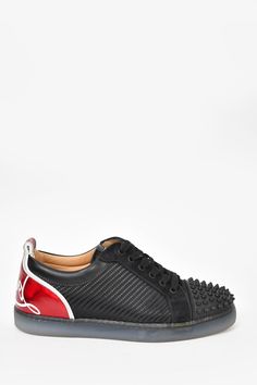 Christian Louboutin Black 'Louis Junior Spike' Sneakers. Front lace up closure. Almond toe. Tonal stitching Original Retail Price: $1250Size: 7Colour: BlackCondition: This item is in good pre-loved condition with minor signs of wear on bottoms and inner soles. Minor scuffs on exterior sides. Designer Leather Sneakers With Spikes, Designer Sports Sneakers With Red Sole, Custom Sneakers With Laces And Round Toe, Designer Sneakers With Red Sole For Sports, Designer Custom Sneakers With Studded Outsoles For Streetwear, Luxury Low-top Custom Sneakers With Perforations, Black Leather Sneakers With Spikes, Luxury Custom Low-top Sneakers With Perforations, Sporty Spiked Leather Sneakers