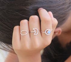 The Outline Moon Ring finds its beauty in its simplicity.Sterling silver shaped in a funky moon shape, made to hug your finger so you never have to take it off ♡.   Easy to style and stack with other rings as it is to wear by itself.Details:This list is for ONE Outline Moon Ring, styled and stack with other rings (not included) all available in our shop.Please remember that each piece is handmade, therefore no two are alike - similar but unique.•► Material: handcrafetd from 925 sterling silver a Minimalist Crescent Midi Rings For Gift, Minimalist Moon Shaped Promise Ring, Minimalist Crescent Midi Rings As Gift, Adjustable Minimalist Moonstone Ring, Dainty Adjustable Moon Shape Midi Rings, Minimalist Moon Phase Midi Rings As Gift, Adjustable Minimalist Moon Midi Rings, Minimalist Moon Charm Rings As Gift, Minimalist Adjustable Moon Phase Rings