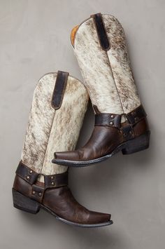 With their unique rugged beauty, no-holds-barred western style, and rich combination of textures, the Florence leather boots are an unforgettable addition to your wardrobe. These handcrafted kicks feature goatskin leather uppers and hair-on cowhide shafts, with goatskin pullstraps for easy wear. Strappy harness detailing with studs adorns each side of the boot, while leather heels and outsoles offer a durable step. With calfskin leather lining, cushioned footbeds, and welt construction. Tall Western Boots, Tall Western Boot, Women's Cowboy Boots, 2024 Wardrobe, Cowboy Boots For Women, Girl Boots, Stylish Footwear, Handmade Boot, Leather Cowboy Boots