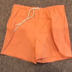 Never Been Worn. Solid Color Swim Trunks For Spring, Orange Short Swimwear For Spring, Solid Cotton Swim Trunks For Beach Season, Solid Cotton Swim Trunks For Summer, Spring Stretch Swim Trunks With Drawstring, Relaxed Fit Solid Swim Trunks For Spring, Casual Orange Bottoms For Poolside, Spring Solid Color Relaxed Fit Swim Trunks, Casual Short Swimwear For Spring