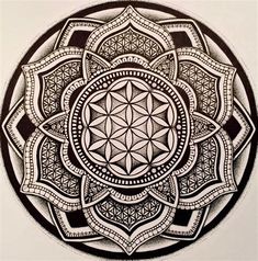 a black and white drawing of a flower of life