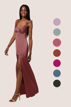 a woman in a long dress standing next to color swatches