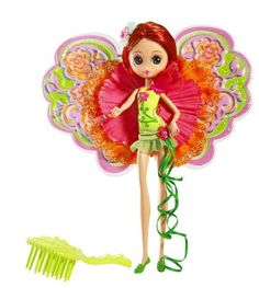 a doll with red hair is holding a green comb