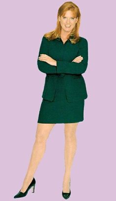 a woman with her arms crossed standing in front of a purple background wearing a green suit