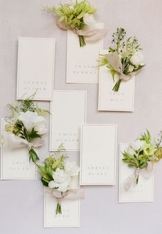 wedding stationery with white flowers and greenery