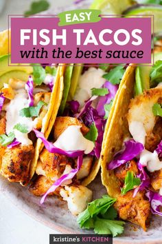 fish tacos with cabbage and avocado garnishes on a plate