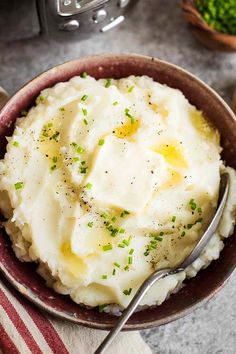 mashed potatoes in a bowl with butter and chives