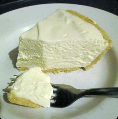 a piece of cheesecake on a plate with a fork