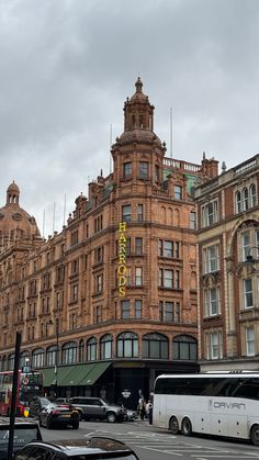 a bus is parked in front of an old building