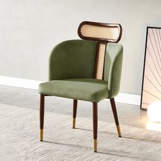 a green chair sitting on top of a carpet covered floor