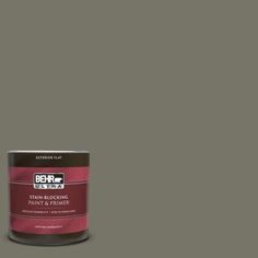 a can of behr ultra paint on a gray background