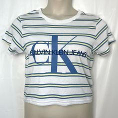 Give Vintage 90’s Vibes In This Short Sleeve, Crew Neck, Crop Top With Blue And Yellow Stripes And Iconic Ck Graphic Logo. Measurements (Laid Flat) - Bust (Pit To Pit) : 18 Inches Waist : 18 Inches Length (From Shoulder) : 19 Inches Sleeve Length (From Seam) : 6 Inches Measurements Are Approx. Fitted Calvin Klein Casual T-shirt, Stretch Cotton Calvin Klein Tops, Calvin Klein Stretch Cotton Tops, Calvin Klein Summer Logo Print Top, Fitted Trendy Calvin Klein Tops, Trendy Fitted Calvin Klein Tops, Trendy Calvin Klein Top With Graphic Print, Blue Calvin Klein Cotton Tops, Calvin Klein Blue Cotton Tops