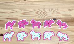 the pixelated elephants are pink and white with blue dots on their backs, as if they were made out of stickers