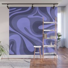 a purple and blue swirl wall mural in a living room