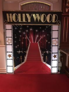 a red carpeted hall with a hollywood entrance