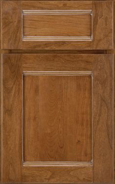 a wooden cabinet door with white trim on the front and side paneled in wood