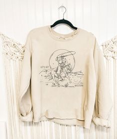 Custom drawn Magnolia Ranch Originals design printed on a unisex super soft tan crewneck sweatshirt with a distressed neckline. S-XL. Tan Crewneck, Cut Sweatshirts, Dog Sweatshirt, Custom Drawing, V Cuts, Unisex Sweatshirt, Magnolia, Crewneck Sweatshirt, Sweat Shirt