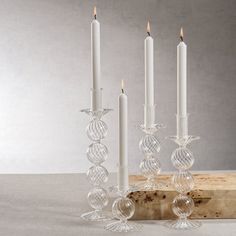 three candles are sitting next to each other on a table