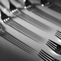 black and white photograph of forks and spoons