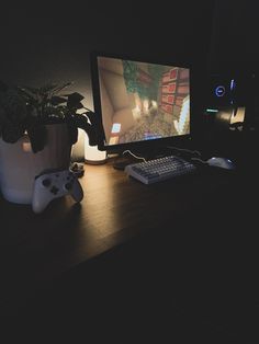 a computer monitor sitting on top of a wooden desk next to a keyboard and mouse