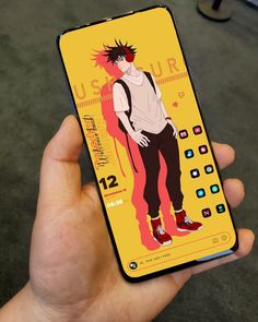 a person holding up a phone with an image of a man on the back cover