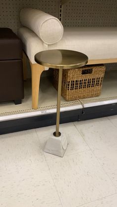 a chair and table in a store next to each other