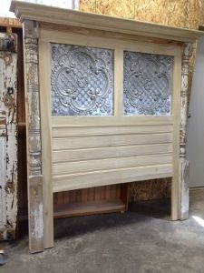 a bed frame made out of wood with glass panels on the top and bottom sides