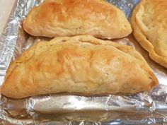 three pieces of bread sitting on top of aluminum foil