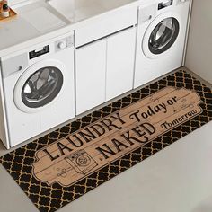 a washer and dryer sitting next to each other in a room with laundry mats on the floor